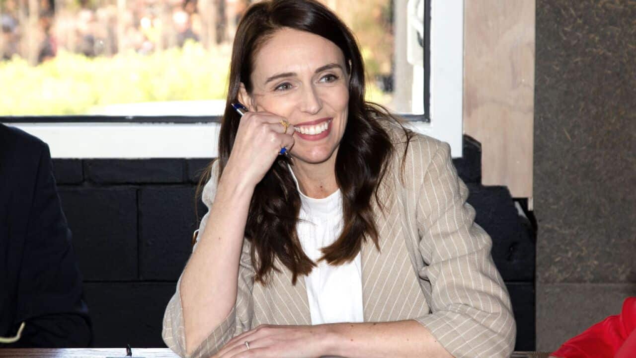 New Zealand Prime Minister Jacinda Ardern speaks with senior members of parliament a day after her landslide election win, in Auckland on 18 October.
