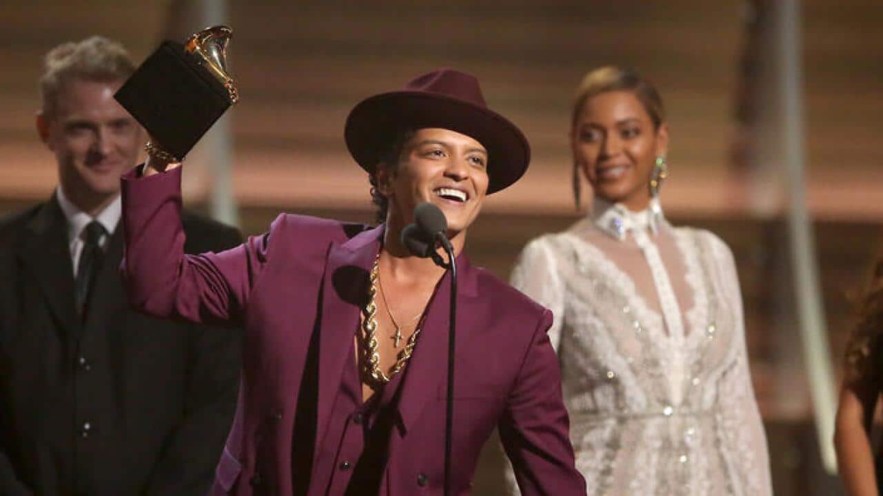 Bruno Mars accepts the award for Record of the Year (AAP)