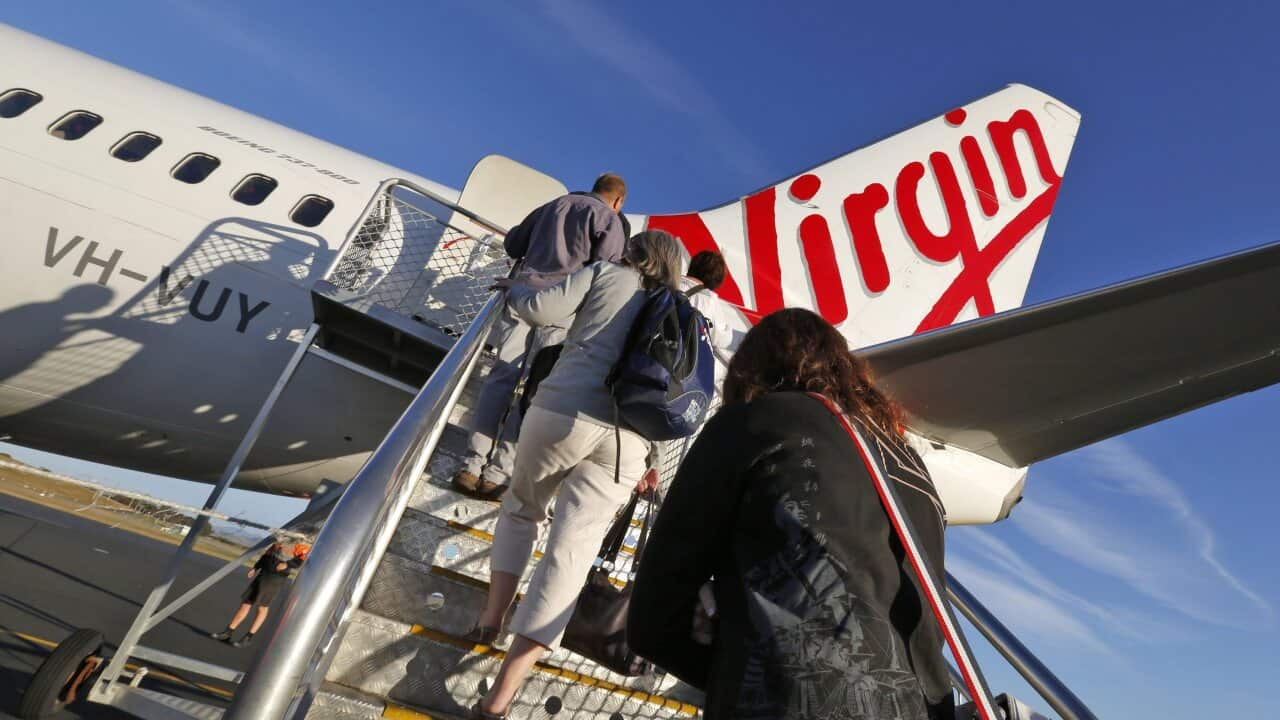 A file photo showing passengers boarding  a Virgin Australia plane at Hobart International  Airport, Tasmania.