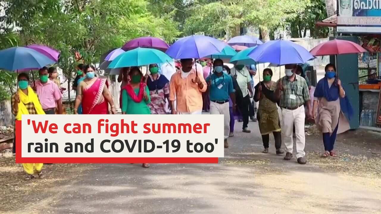 Armed with umbrellas, Indian villagers combat coronavirus