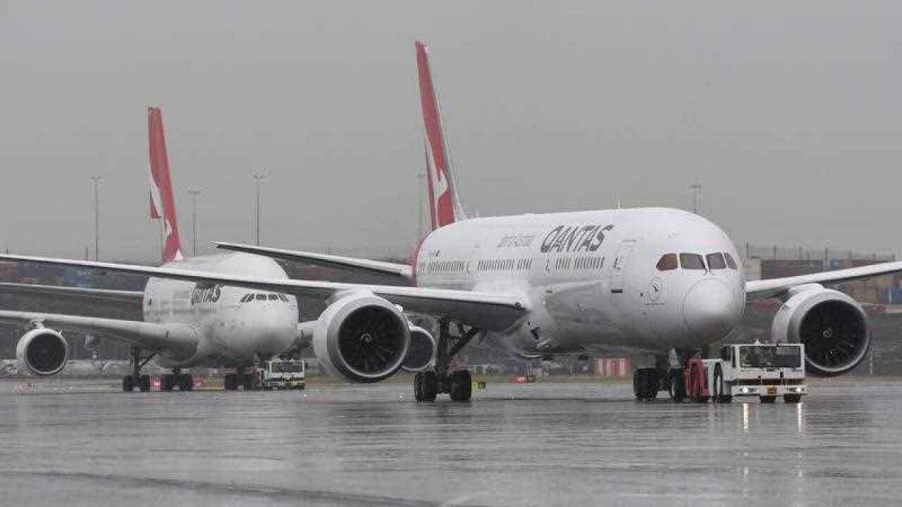 The new QANTAS Boeing 787 Dreamliner aircraft is followed by an A380 Airbus