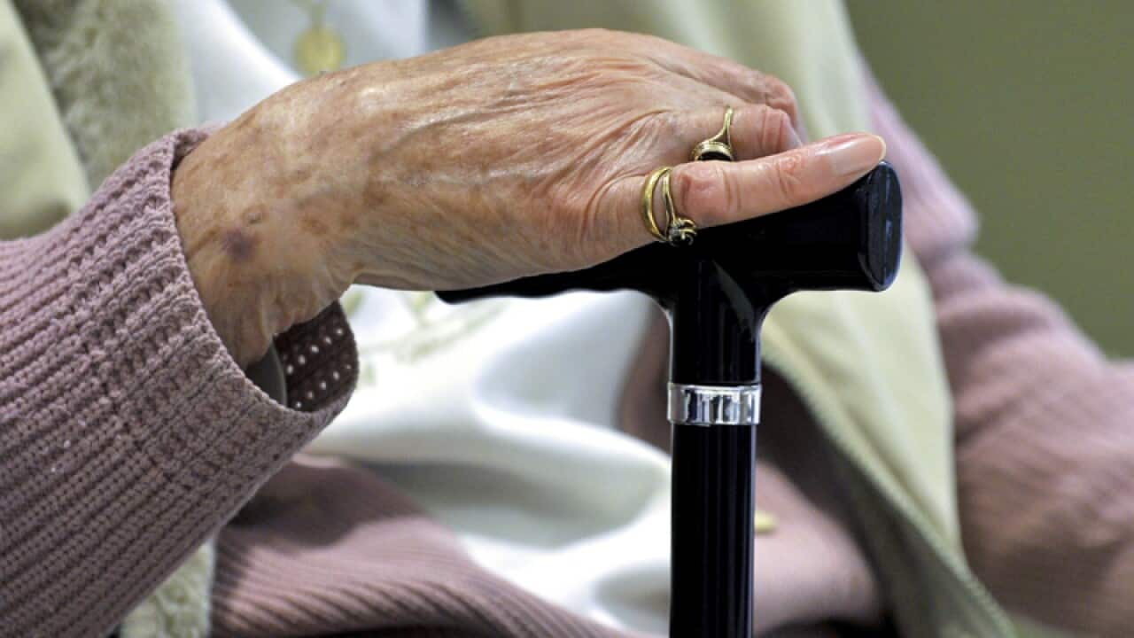 An elderly woman.