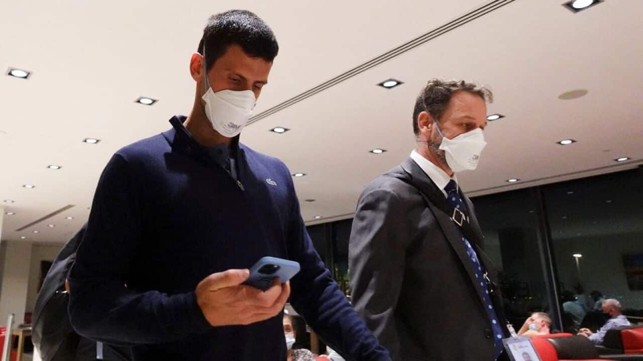 Novak Djokovic at Melbourne Airport before boarding a flight.