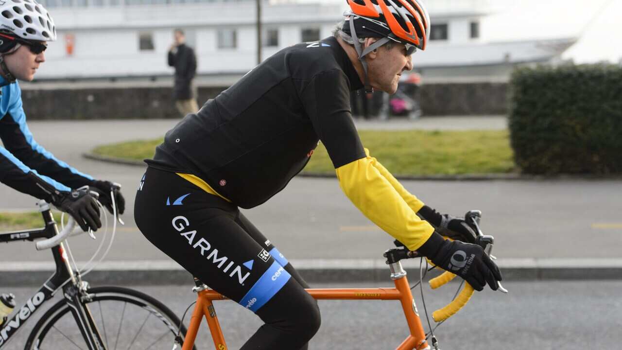 A file picture dated 16 March 2015 shows US Secretary of State John Kerry riding a bike in full gear after a bilateral meeting with Iranian Foreign Minister Zarif (not pictured) for Nuclear Talks, in Lausanne, Switzerland. (EPA/JEAN-CHRISTOPHE BOTT)