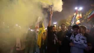 Iranians after Iran launched a missile attack on Israel, next to the British embassy.