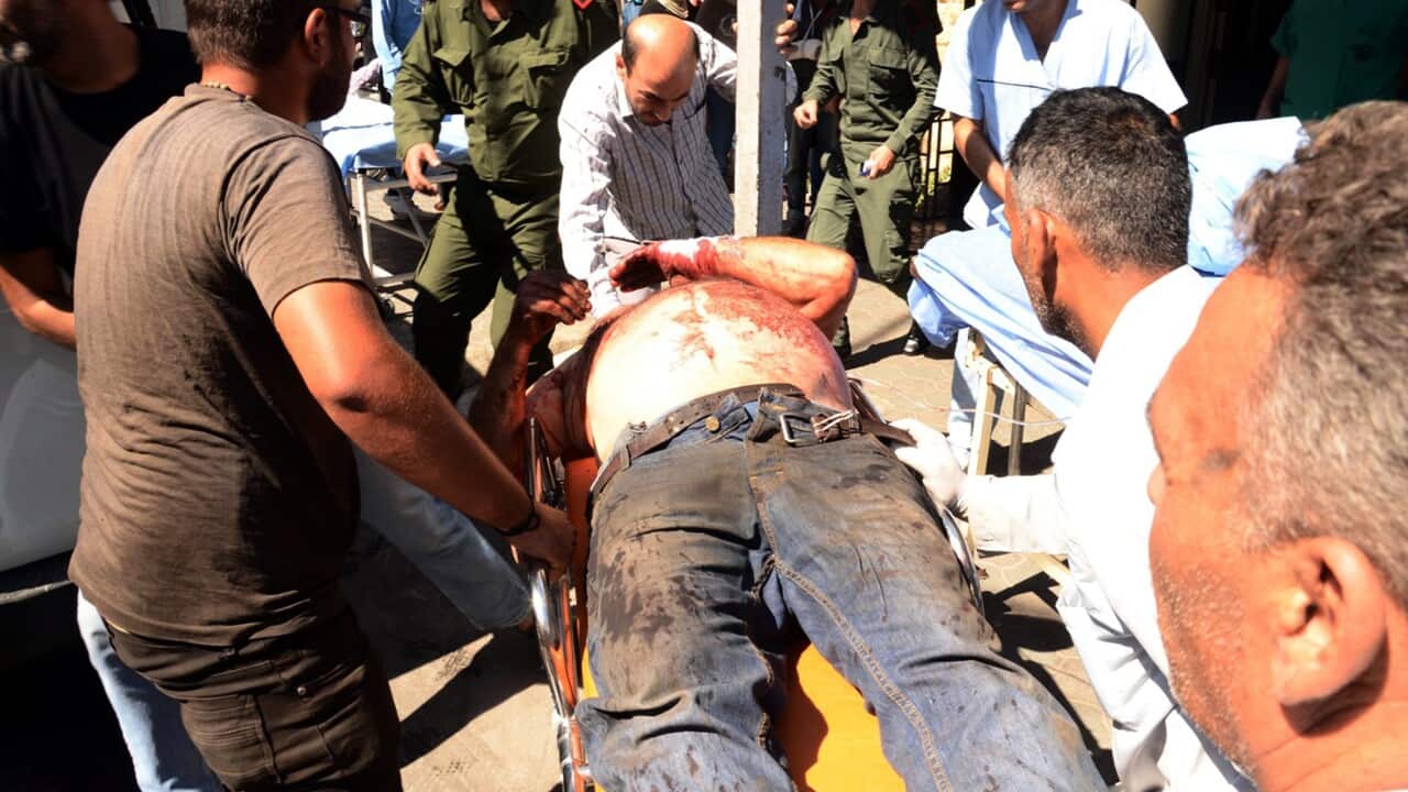A handout photo released by Syria's Arab News Agency (SANA) shows an injured civilian being transferred to a hospital, Aleppo, Syria, 28 September 2016