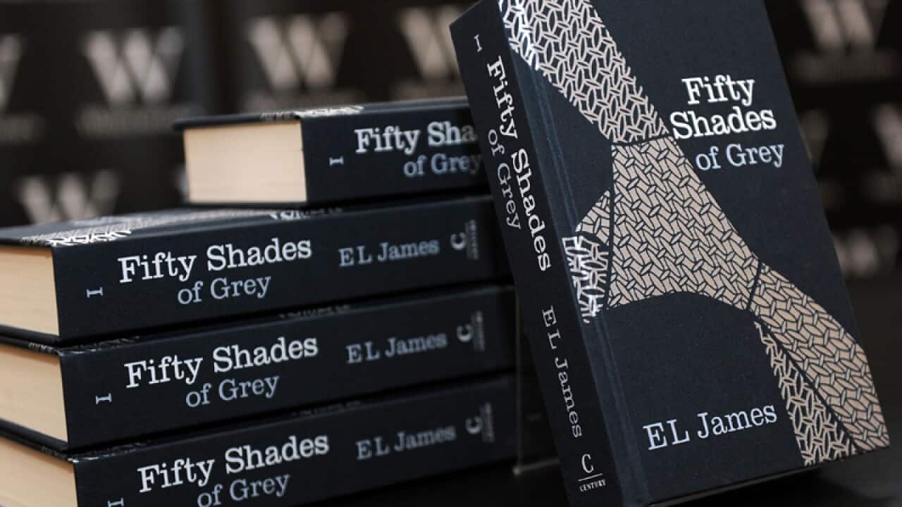 A pile of Fifty Shades of Grey books