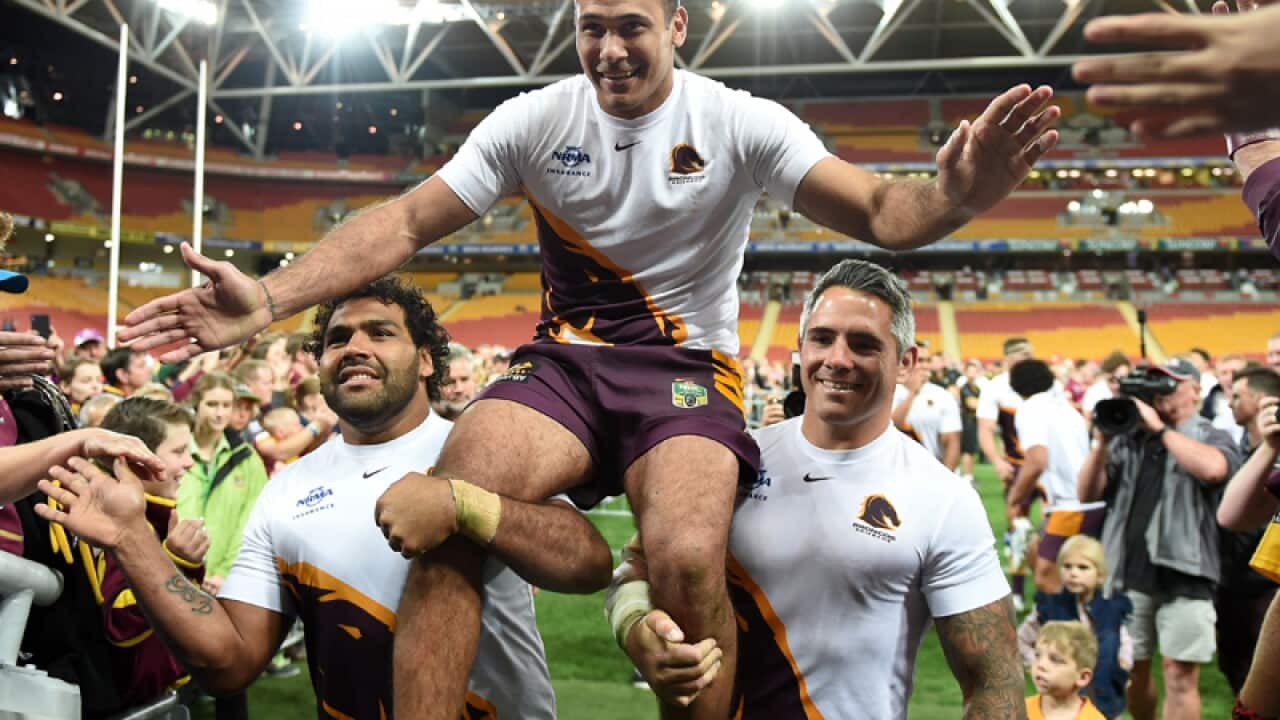 Justin Hodges of the Brisbane Broncos is chaired off the field