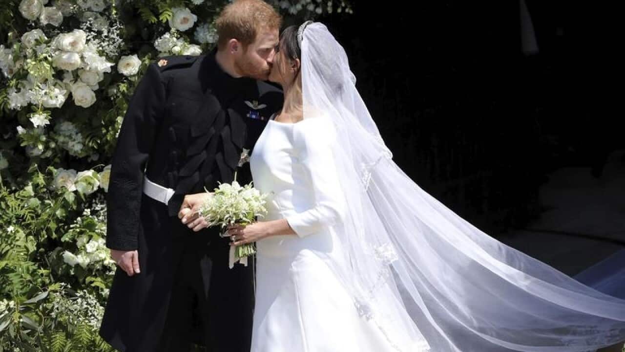 Prince Harry and Meghan Markle kiss after their wedding.
