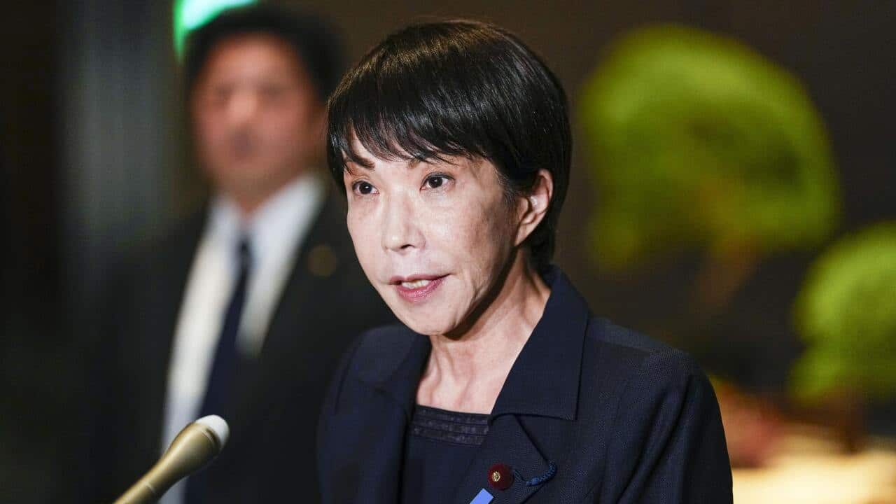 Japan's Prime Minister Sanae Takaichi speaks to reporters at the prime minister's office in Tokyo after a strong earthquake struck northeastern Japan.