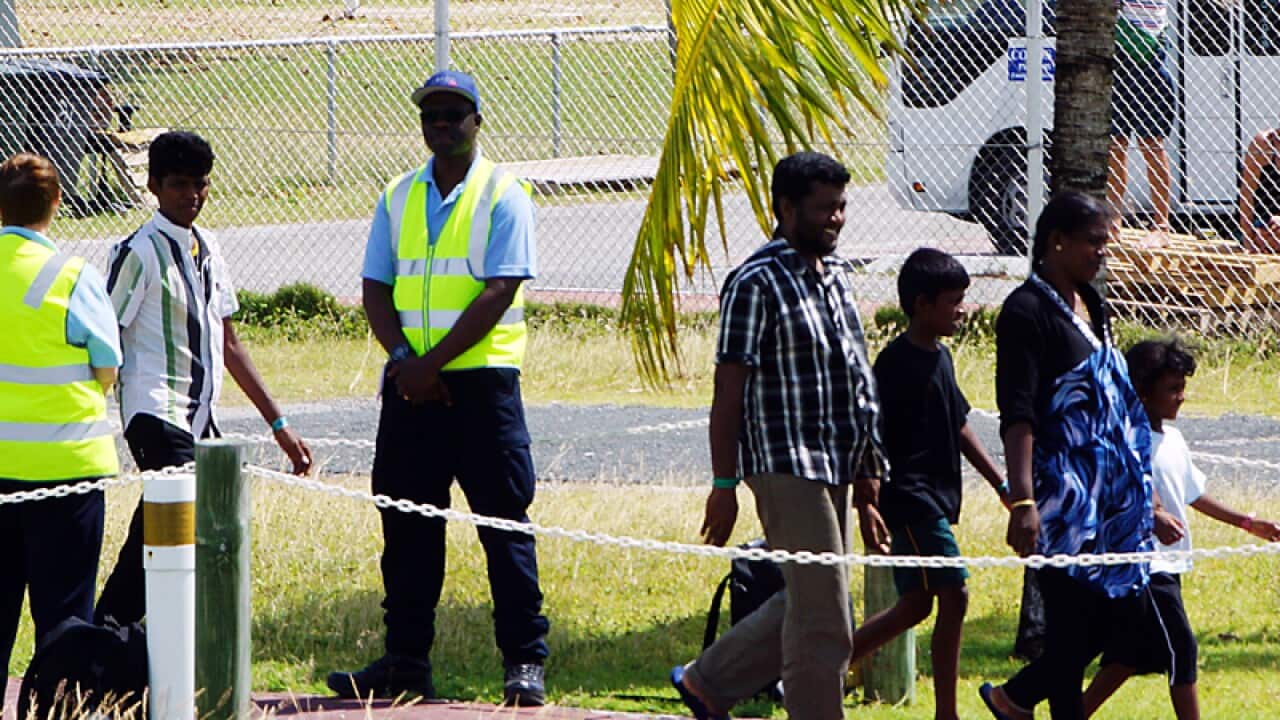 Asylum seekers on Cocos Islands before transfer to Curtin IDC.