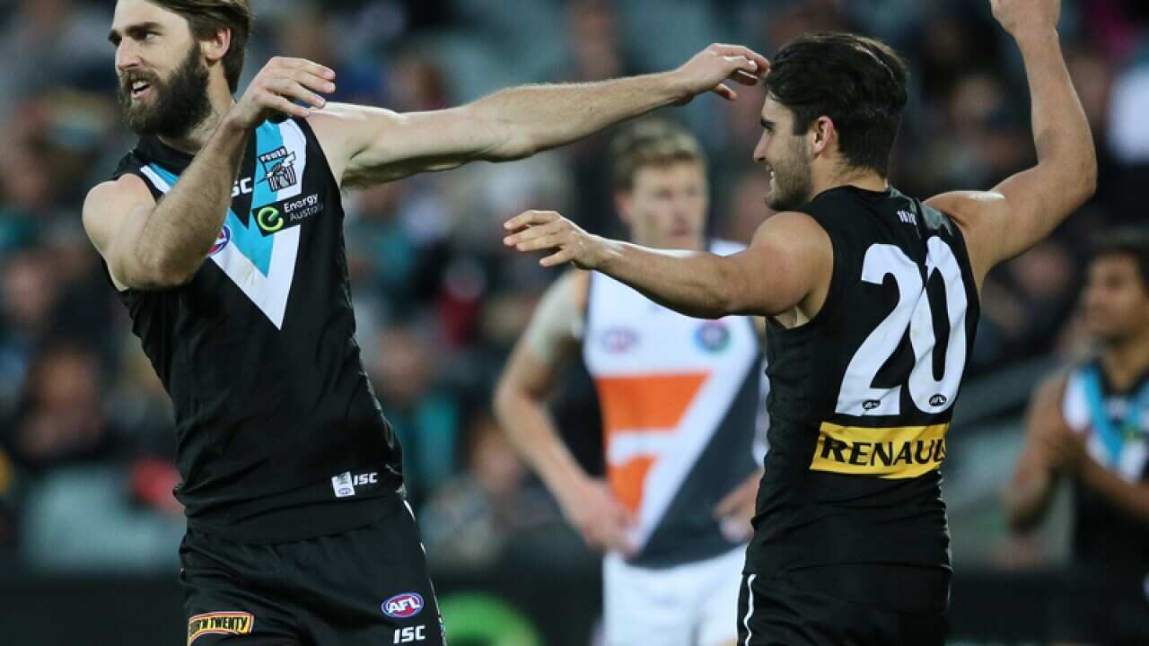 Justin Westhoff of the Power is congratulated by teammate Chad Wingard