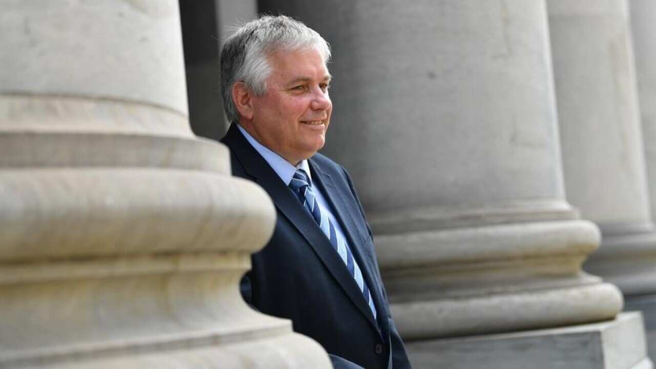 Rex Patrick poses for photograph outside South Australian Parliament.