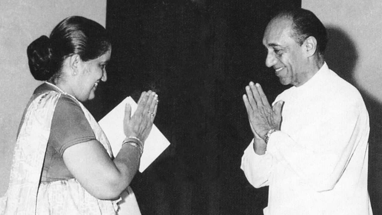 Former Premier Sirimavo Bandaranaike greeting President J. R. Jayewardene.