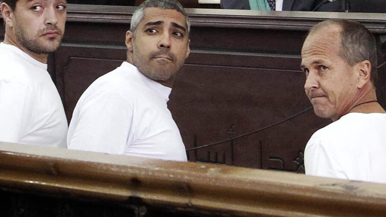 Journalists Baher Mohamed (L)Mohammed Fahmy (R) and Peter Greste