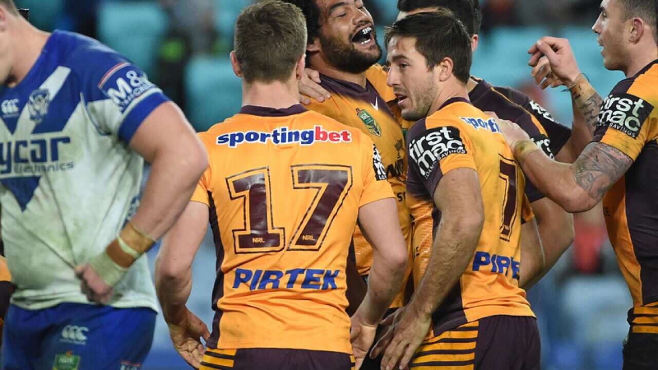 Broncos forward Adam Blair (C) celebrates after scoring