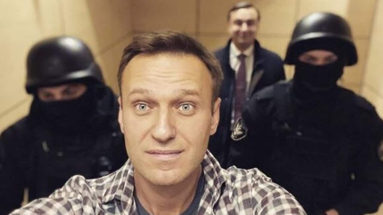 Russian opposition leader Alexei Navalny snapped a series of selfies with police officers during his arrest.