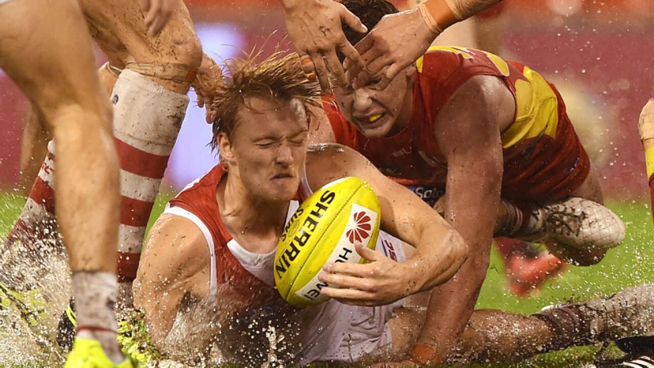 Sydney's James Rose (centre) competes for the ball