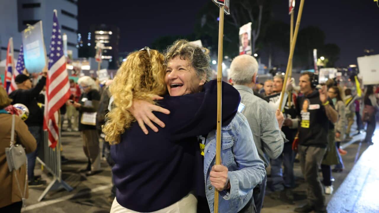 Two women hugging