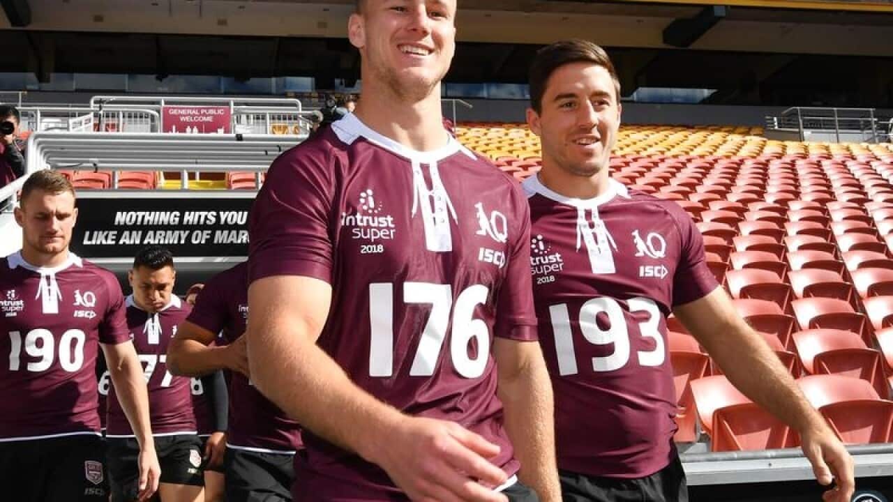 Queensland Maroons players Daly Cherry-Evans (C) and Ben Hunt (R)
