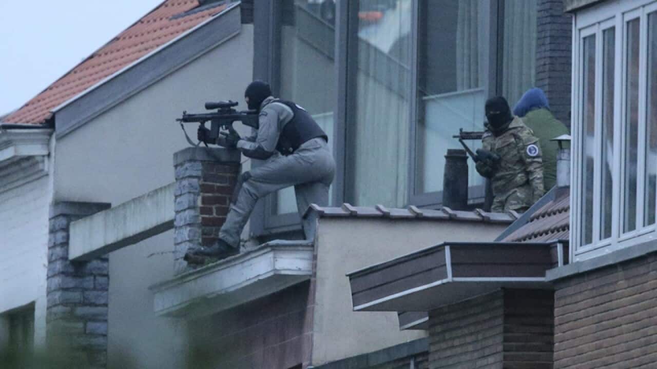 Security forces take position during an operation on Brussels
