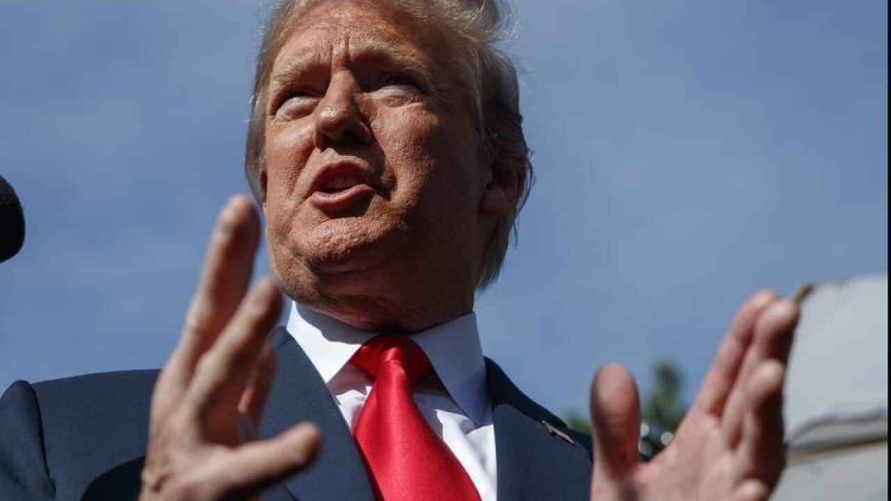 President Donald Trump speaks to reporters at the White House