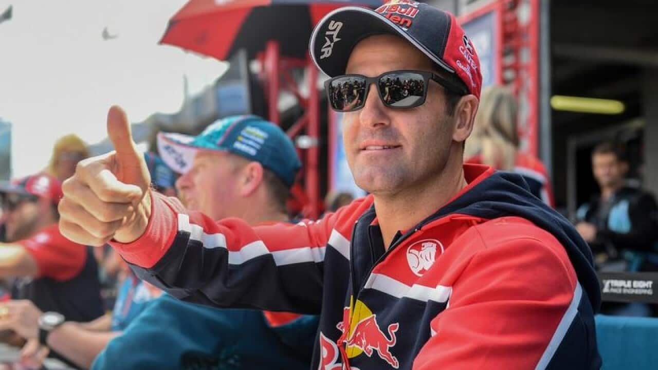 Supercar driver Jamie Whincup gestures