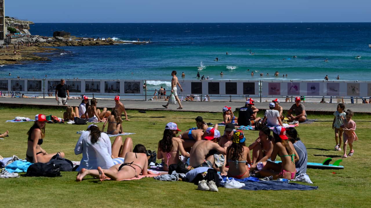 Members of the public are seen at Bondi Beach in Sydney, 15 December 2021.