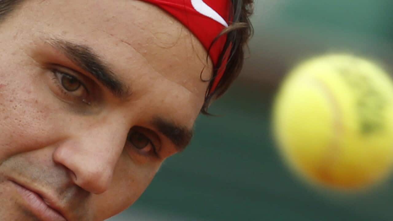 Switzerland's Roger Federer returns the ball.