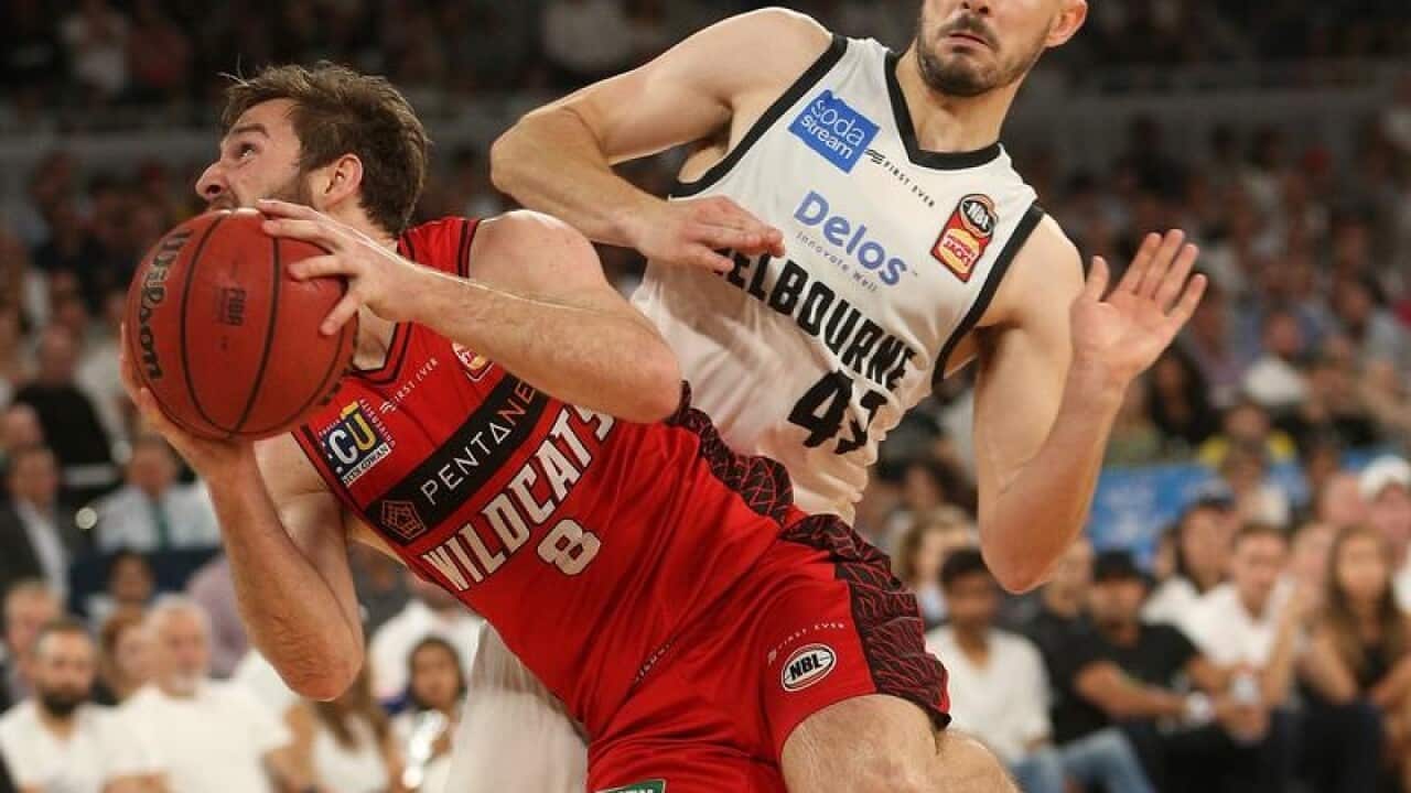 Melbourne United's Chris Goulding and Perth's Mitch Norton.