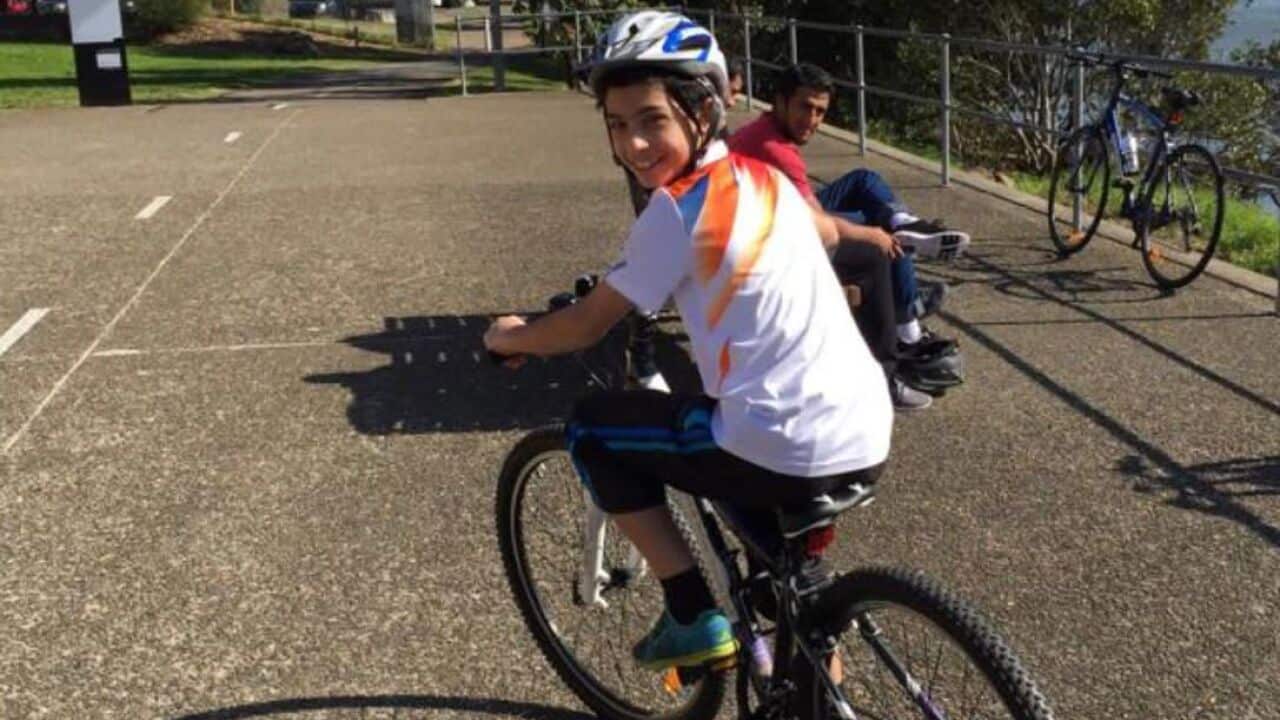 Yusuf Zahab riding a bike.