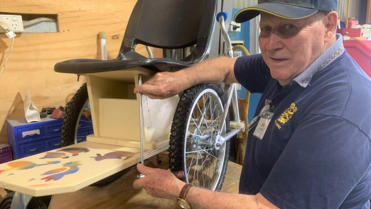 Inventor Des La Rance with a wheelchair made from repurposed bicycles. SBS, Matt Guest .jpg