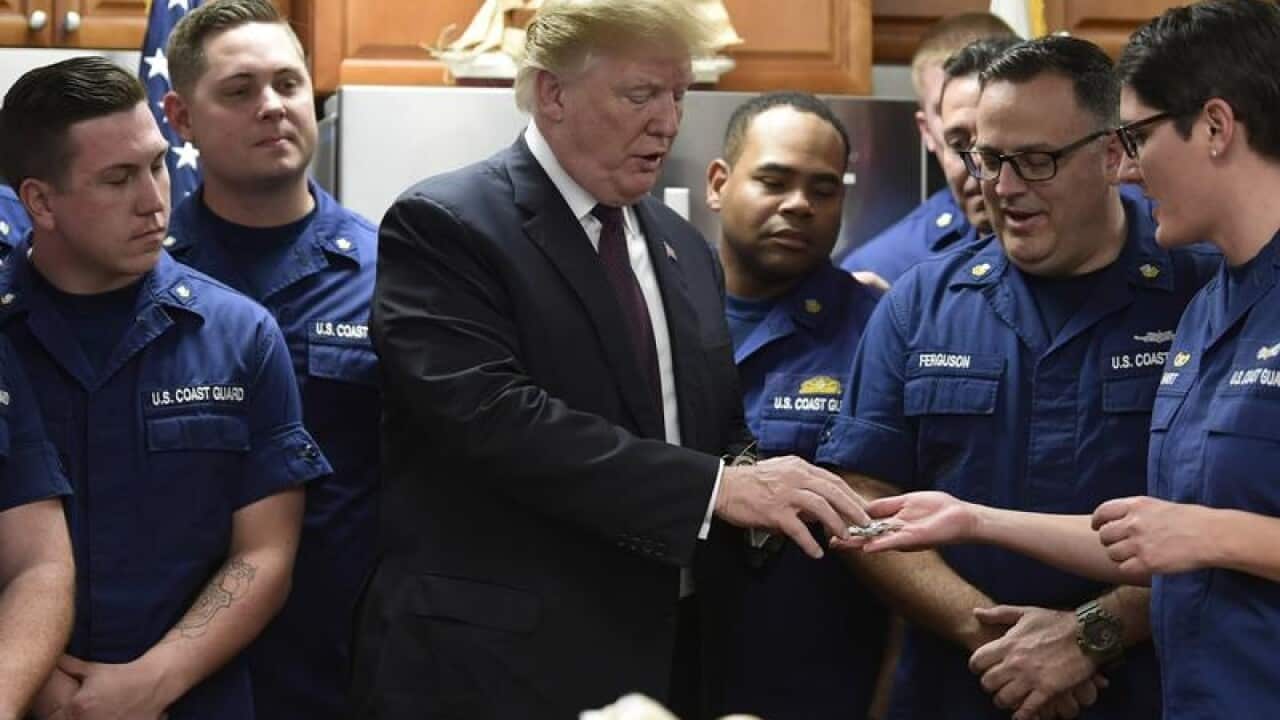 President Donald Trump meets members of the US Coast Guard
