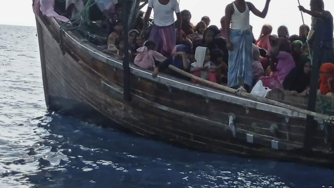 Rohingya refugees on a wooden boat off Bireuen, Aceh province, Indonesia