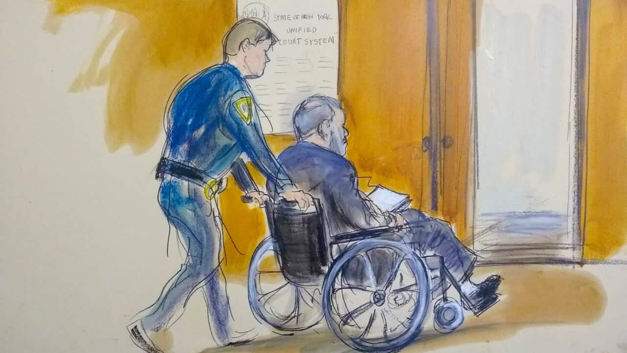 In this courtroom sketch a court officer wheels Harvey Weinstein out of a Manhattan courtroom after his sentencing