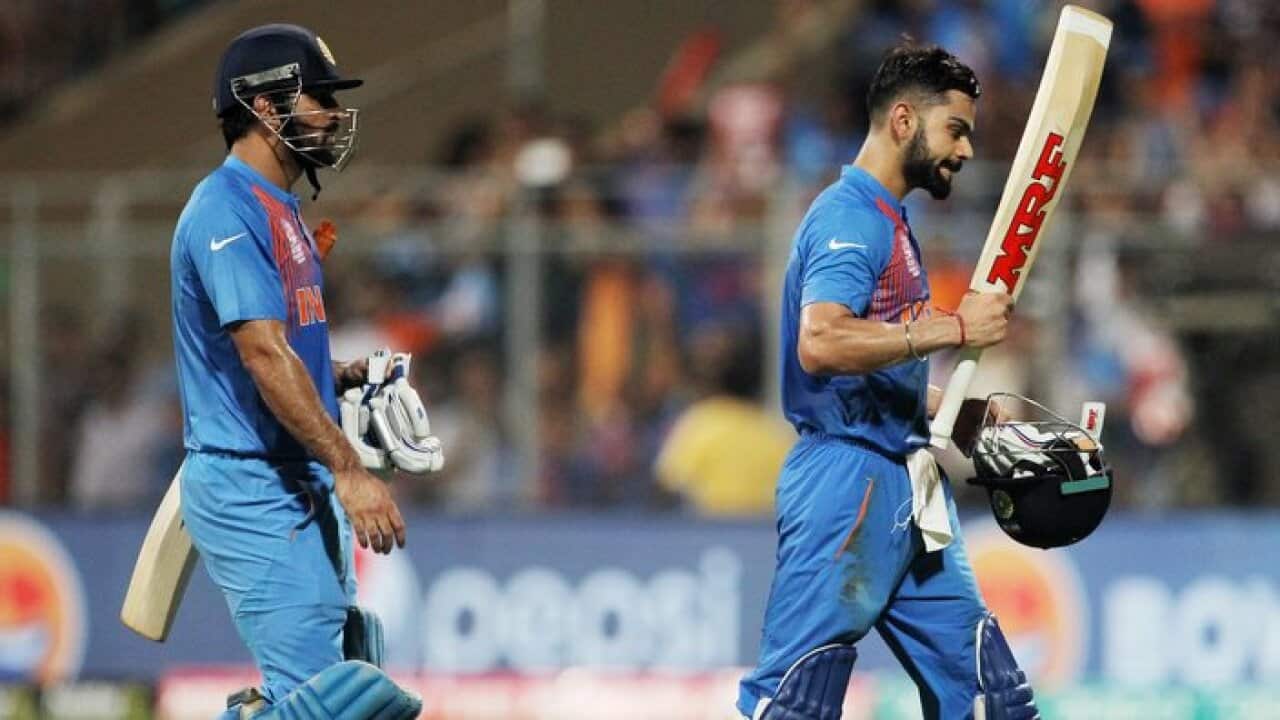 India's Virat Kohli, right, leaves the field with teammate MS Dhoni during their ICC World Twenty20 2016 cricket semifinal match against the West Indies at Wankhede stadium in Mumbai, India,Thursday, March 31, 2016.(AP Photo/Rafiq Maqbool)