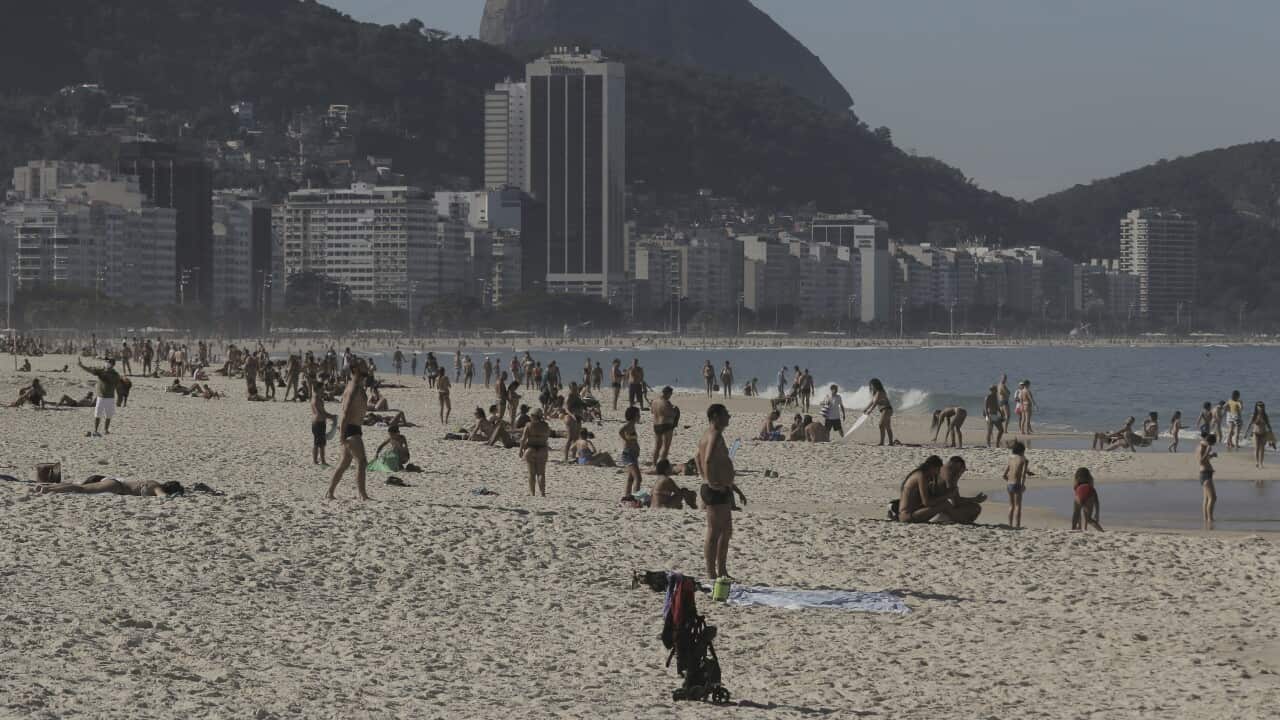 Bathers on the sand of Copacabana beach in Rio de Janeiro