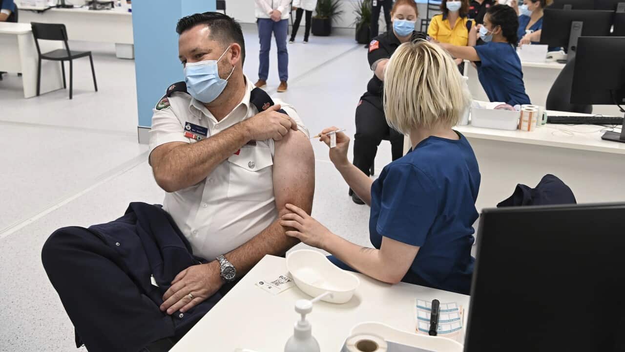 A Pfizer vaccine is administered at the COVID-19 Vaccination Centre in Sydney
