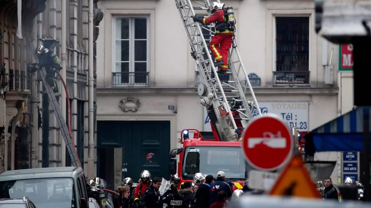 Firefighters at the scene of an explosion at a bakery near Rue de Trevise in Paris.