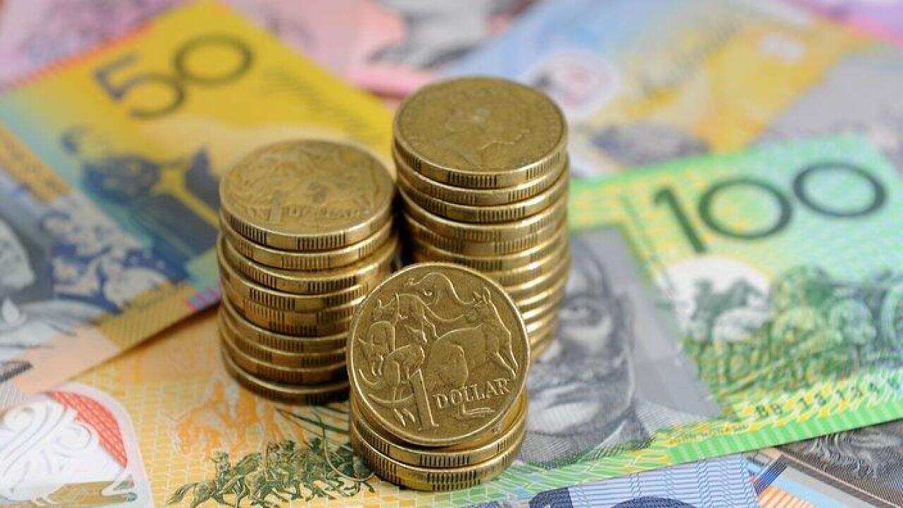 Australian dollars in Sydney, Friday, Jan. 15, 2016. (AAP Image/Joel Carrett) NO ARCHIVING