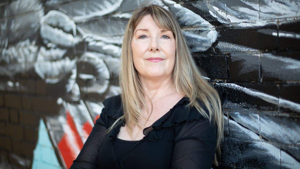 A woman wearing a black shirt