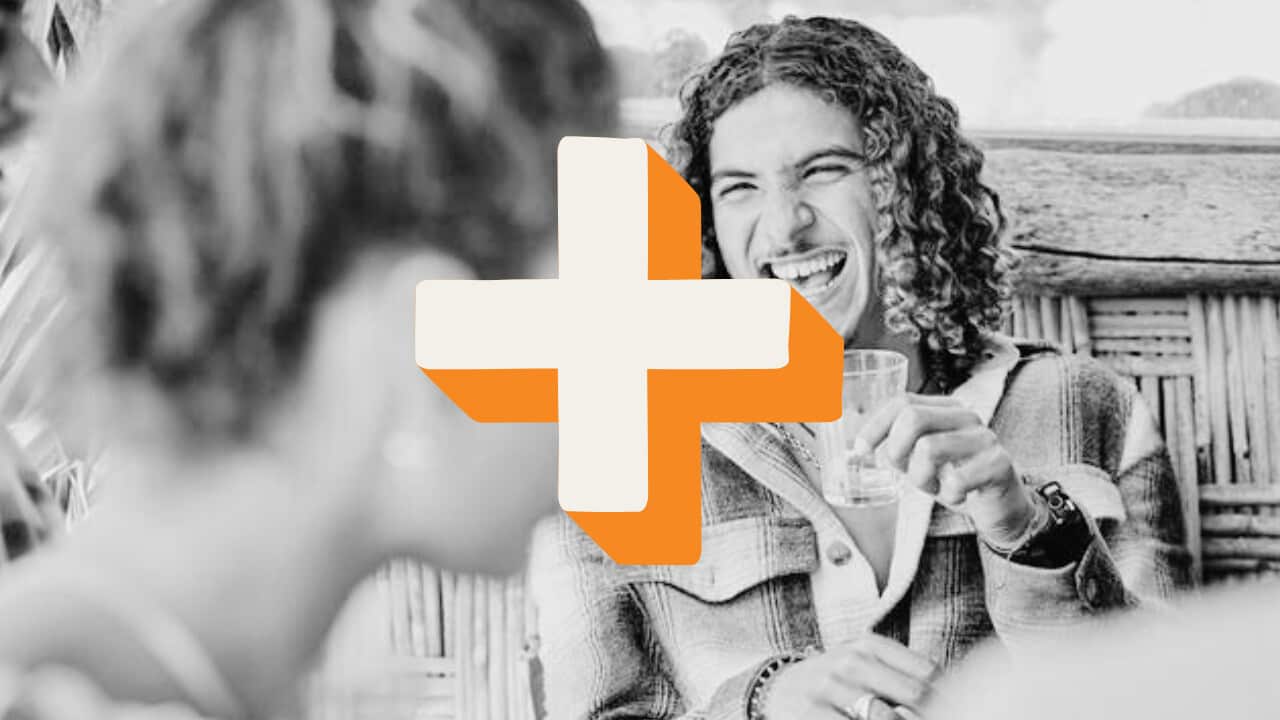 A man holds an empty drink