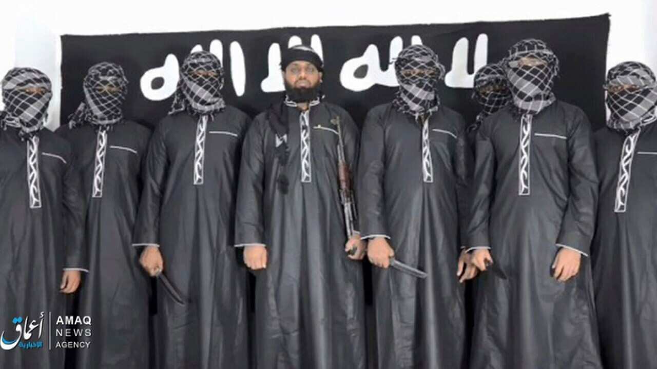 Image posted by the IS Aamaq news agency, purporting to show Mohammed Zahran (c) the man Sri Lanka says led the Easter attacks (AAP)