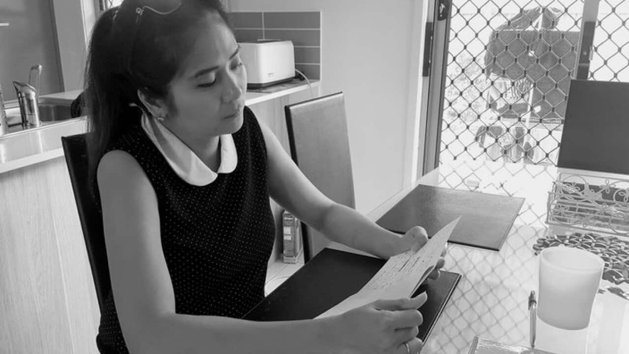 Bernadette Romulo reads out the letter of her son