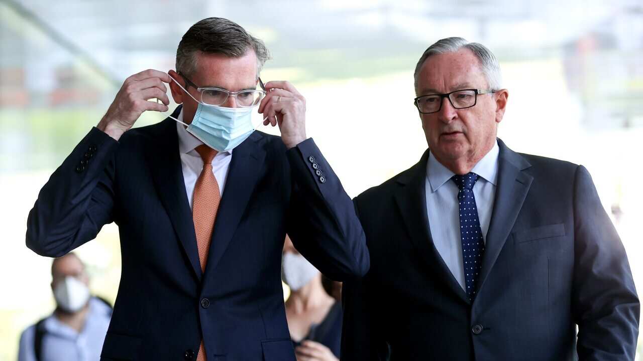 NSW Premier Dominic Perrottet and Minister for Health Brad Hazzard depart a press conference in Sydney, Monday, January 17, 2022. NSW has reported 29,504 new COVID-19 cases and a further 17 virus-related deaths. (AAP Image/Brendon Thorne) NO ARCHIVING