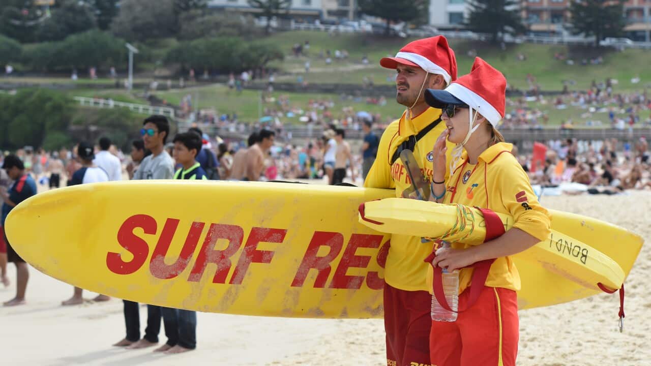 Surf Life Savers monitor swimmers and conditions at Bondi Beach in Sydney (AAP).