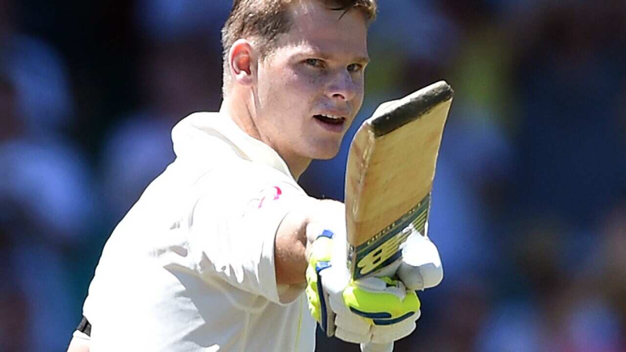 Steve Smith celebrates scoring a century