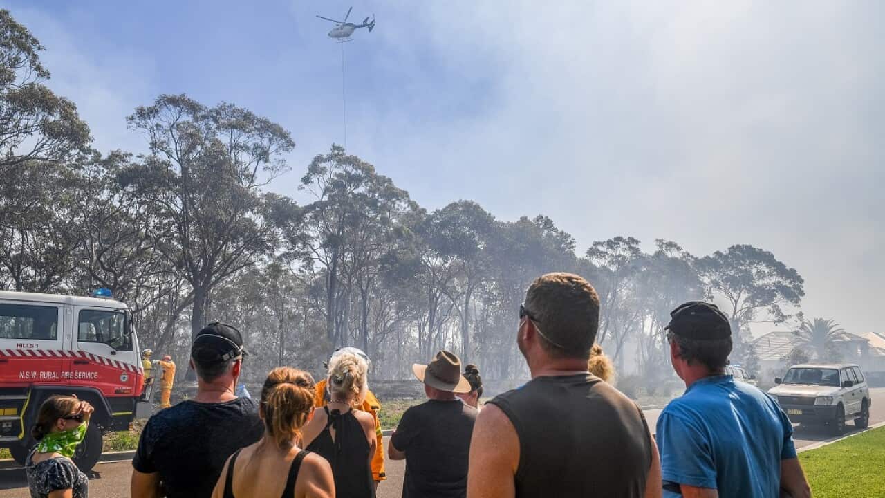 Residents and firefighters have saved 500 homes from a ferocious bushfire in southwest Sydney.
