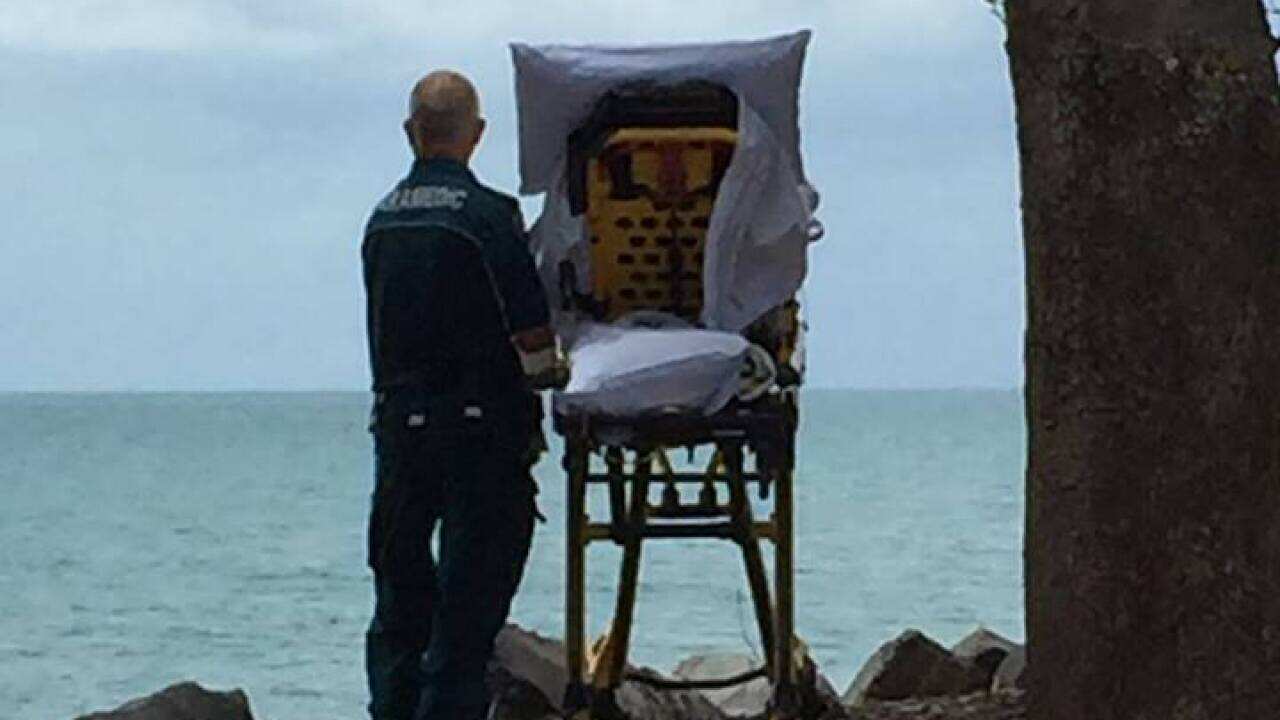 Queensland Ambulance Service shared photo of paramedics granting palliative patient a wish.
