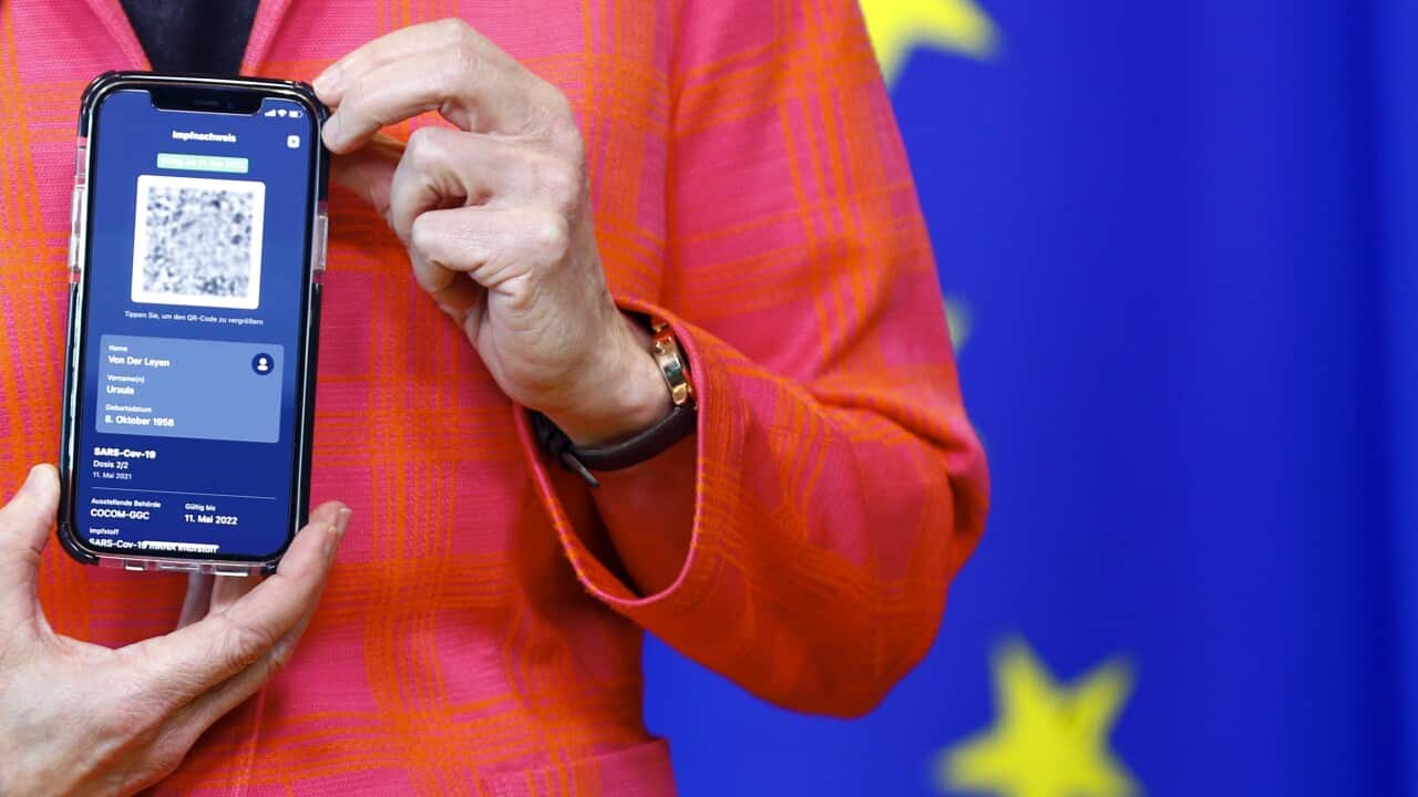 EU Commission President Ursula von der Leyen shows a phone, as she gives a press statement on the new COVID-19 digital travel certificate at the EU Commission headquarters in Brussels, Wednesday, June 16, 2021. (Johanna Geron/Pool Photo via AP